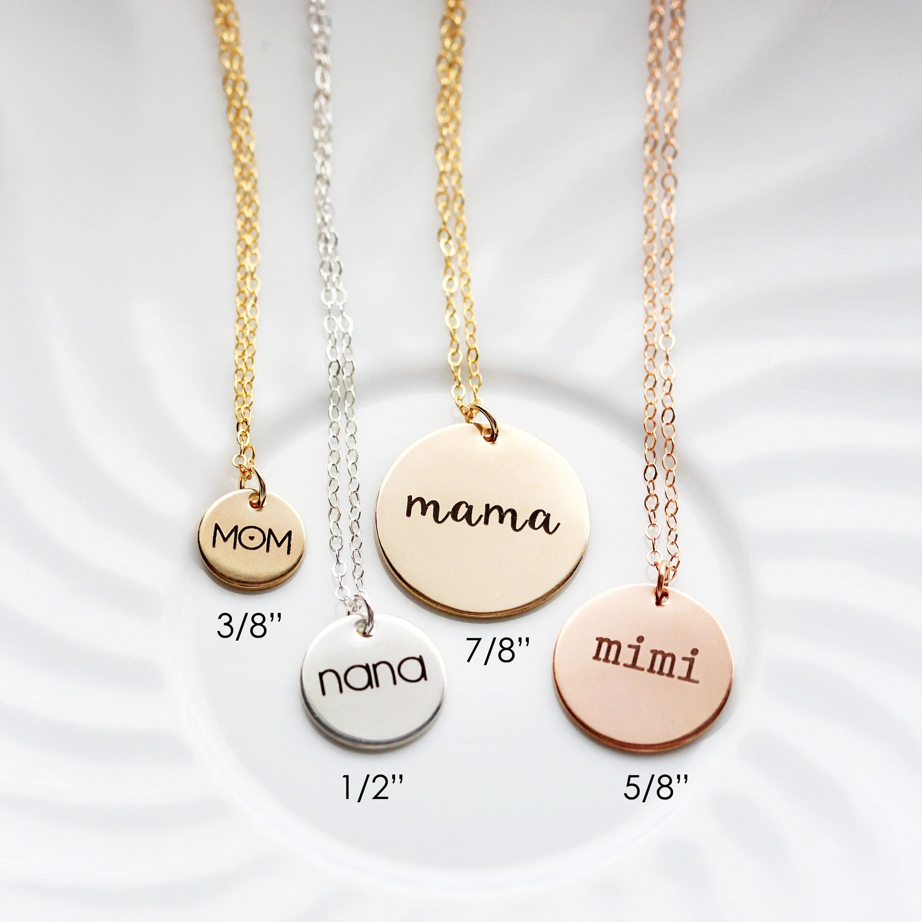 Person holding gold-colored chain necklace