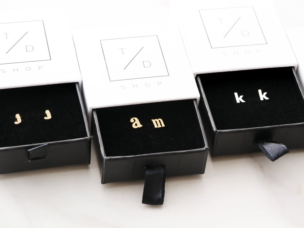 Lowercase letter earrings from Tom Design Shop.