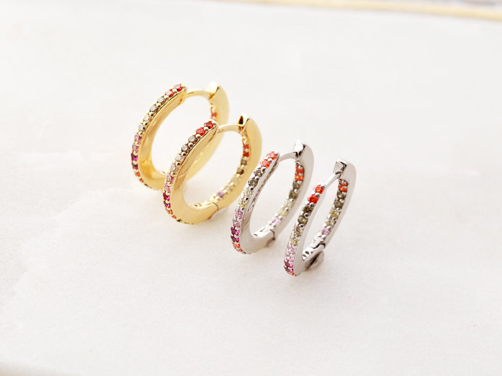 Custom jewelry by Tom Design Shop. Gold and silver hoop earrings.