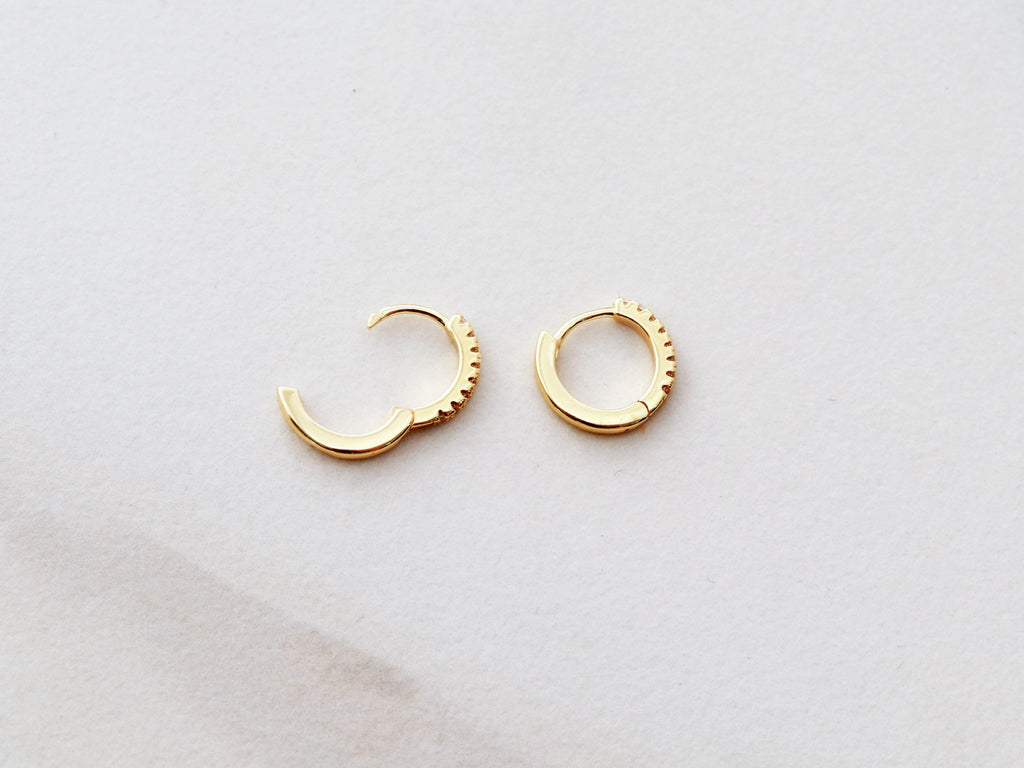 Huggie Earrings from Tom Design Shop offer a clasp design and can be ordered in gold, silver, or rose gold.