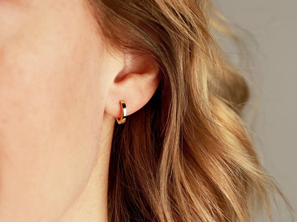 Tom Design Shop offers gold, silver, and rose gold solid hoop earrings. 
