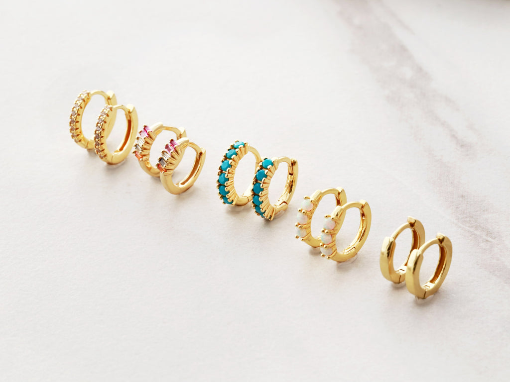 Tiny Rainbow Huggie Earrings by Tom Design Jewelry.