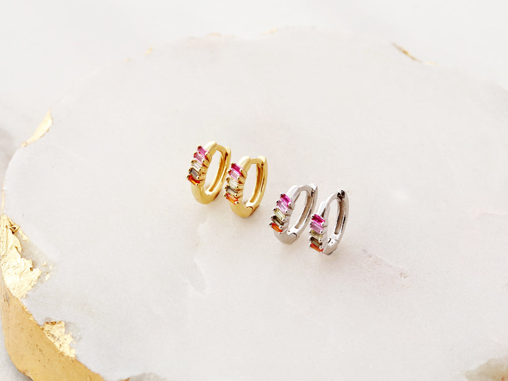 Tiny Rainbow Huggies Earrings in gold and silver from Tom Design Shop.