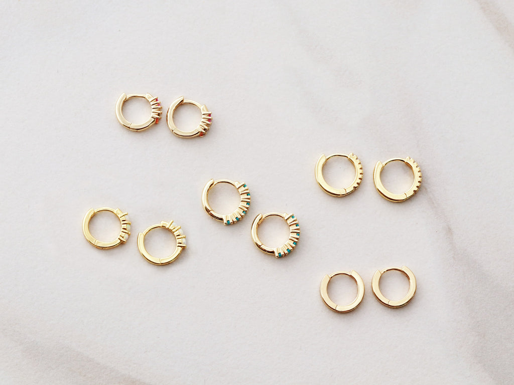 Huggie Earrings in gold by Tom Design Shop.