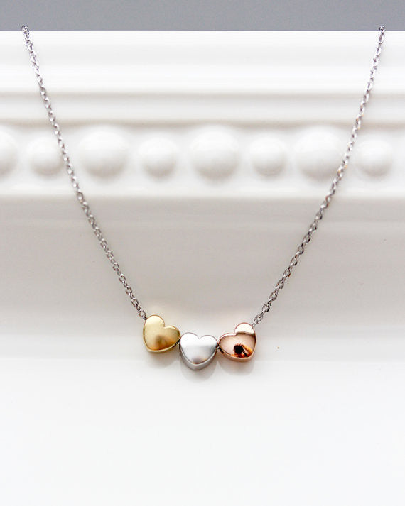 Three heart on sale necklace gold